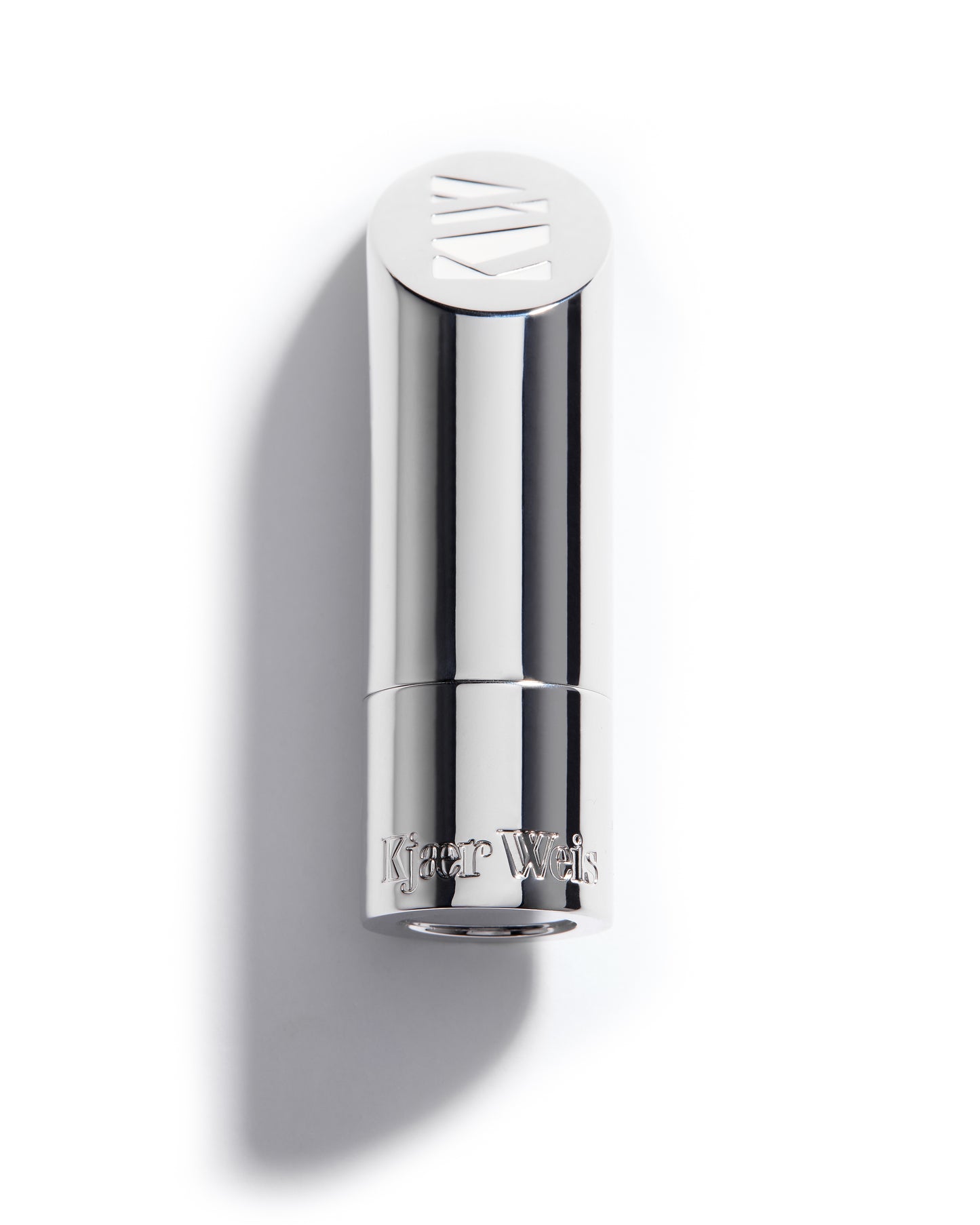 Solid metal lip balm bullet with KW and Kjaer Weis embossed