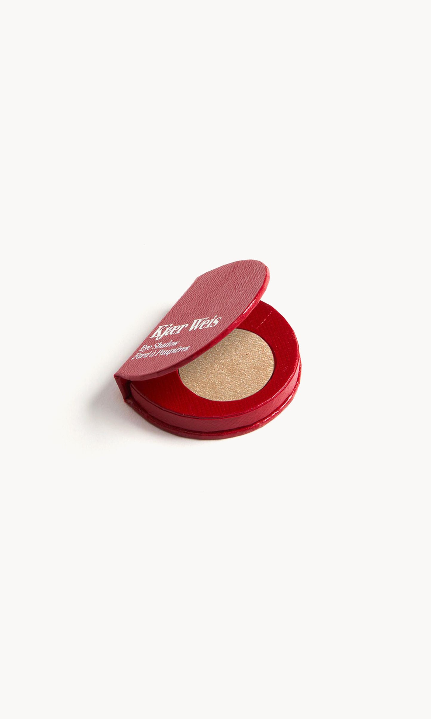 Red KW palette open to show the warm beige eye shadow inside