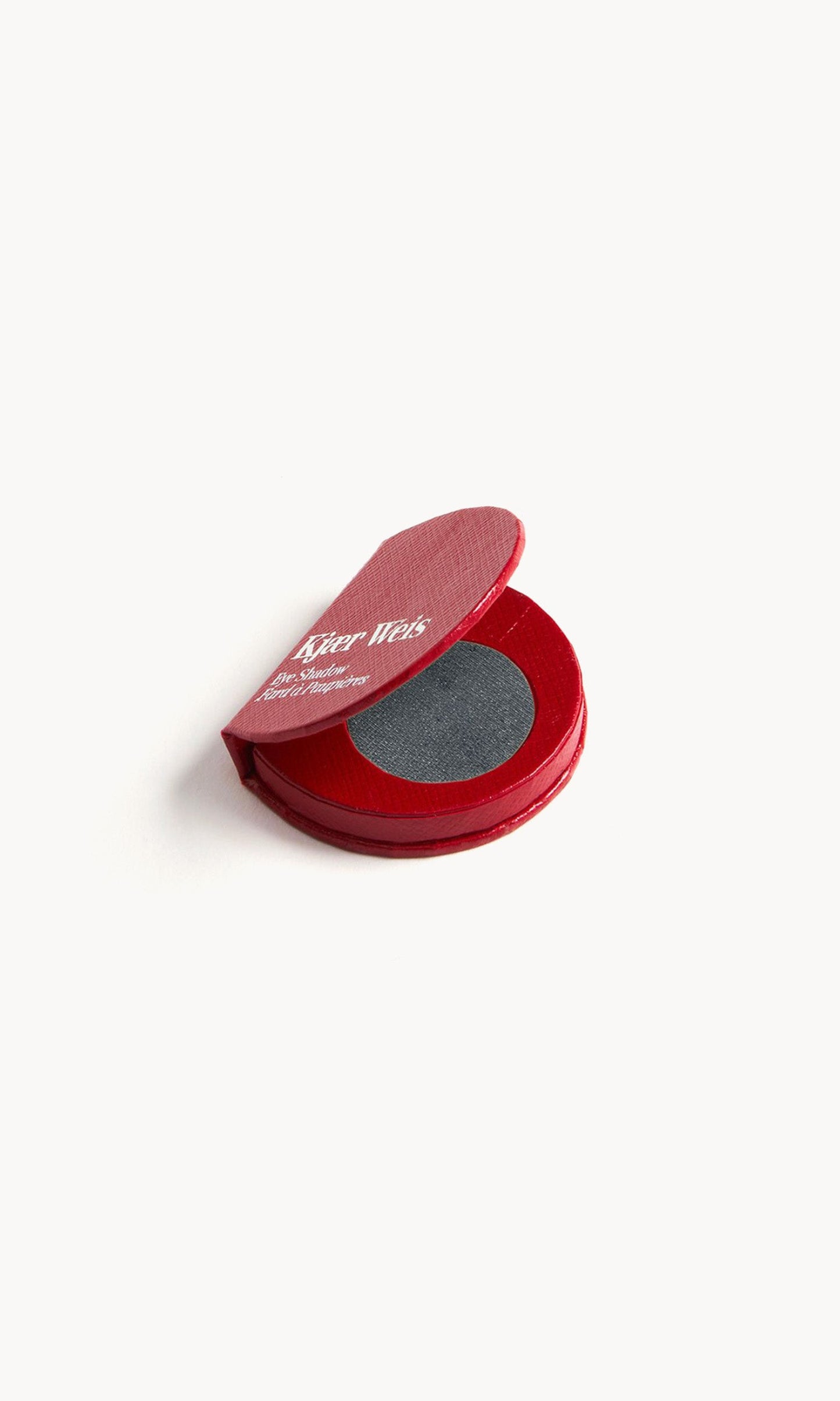 Red KW palette open to show the dark neutral grey eye shadow inside