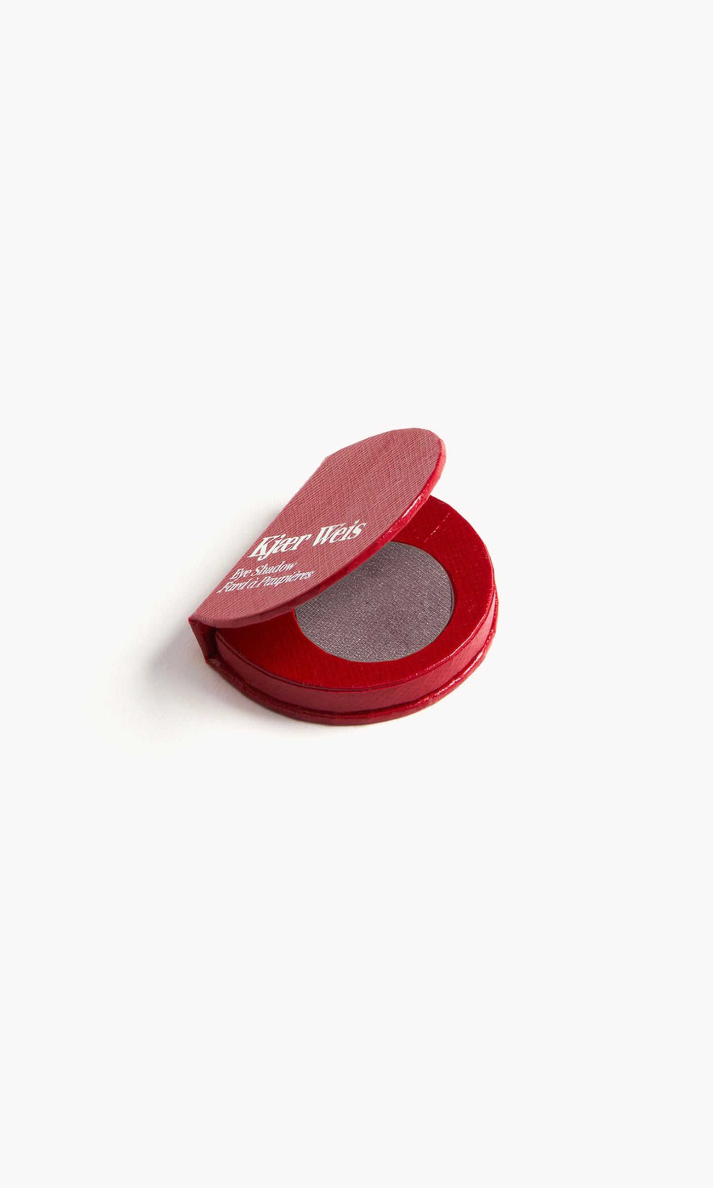 Red KW palette open to show the greyish purple eye shadow inside