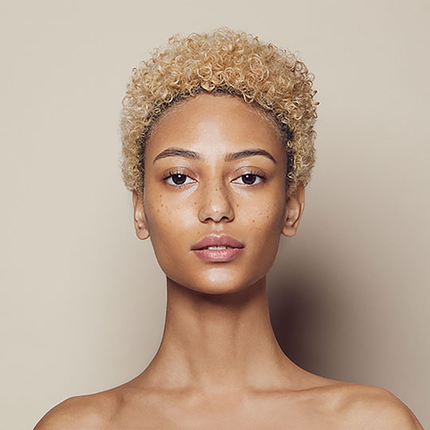 Close up of person’s face with tan, cool-toned skin