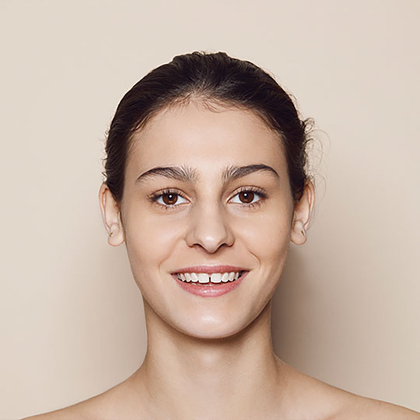 Close up of person’s face with medium, neutral-toned skin