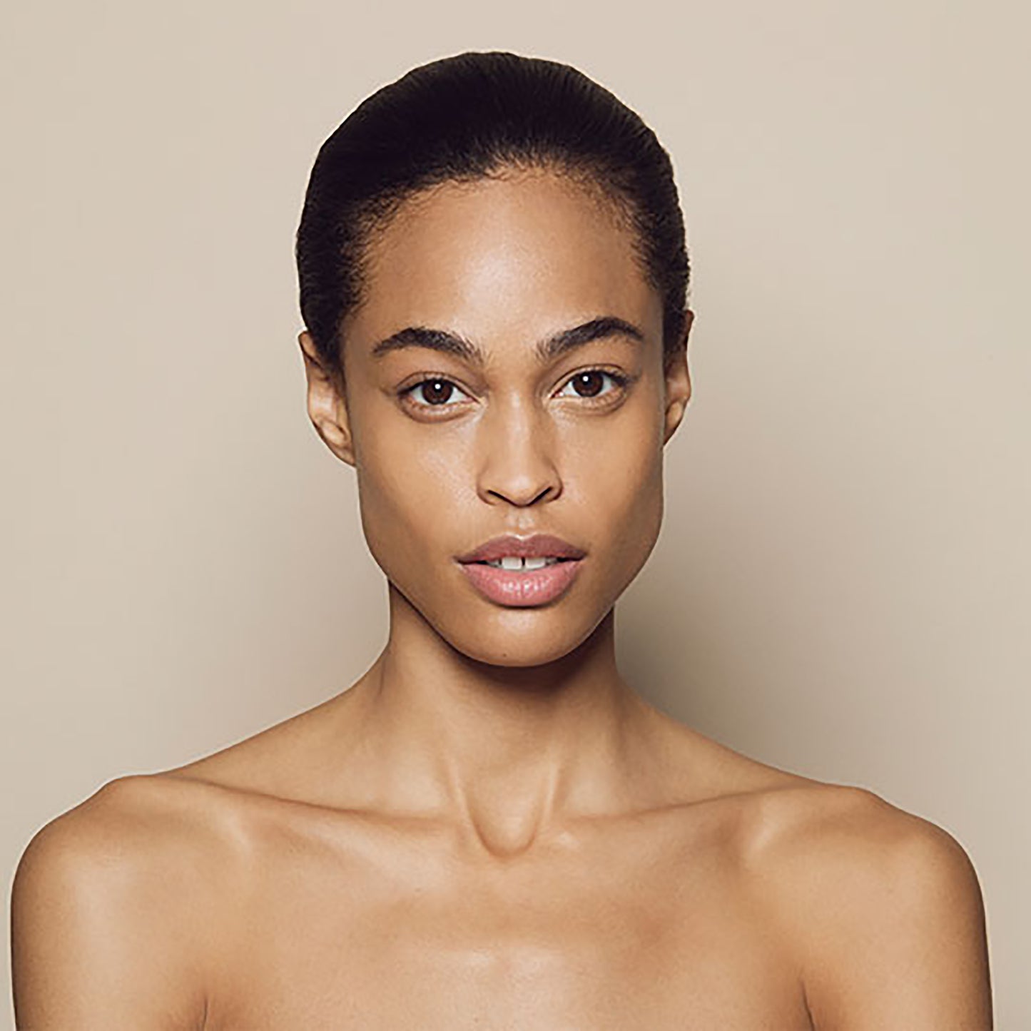 Close up of person’s face with medium, warm-toned skin