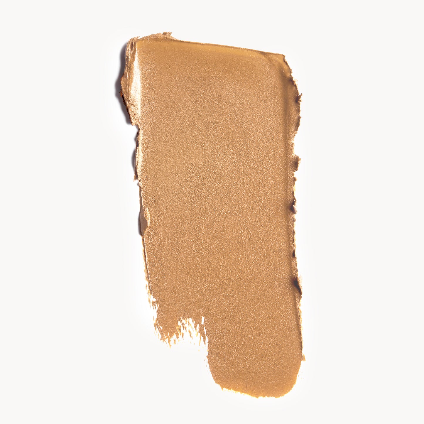 A wipe of medium, cool-toned cream foundation on a white background