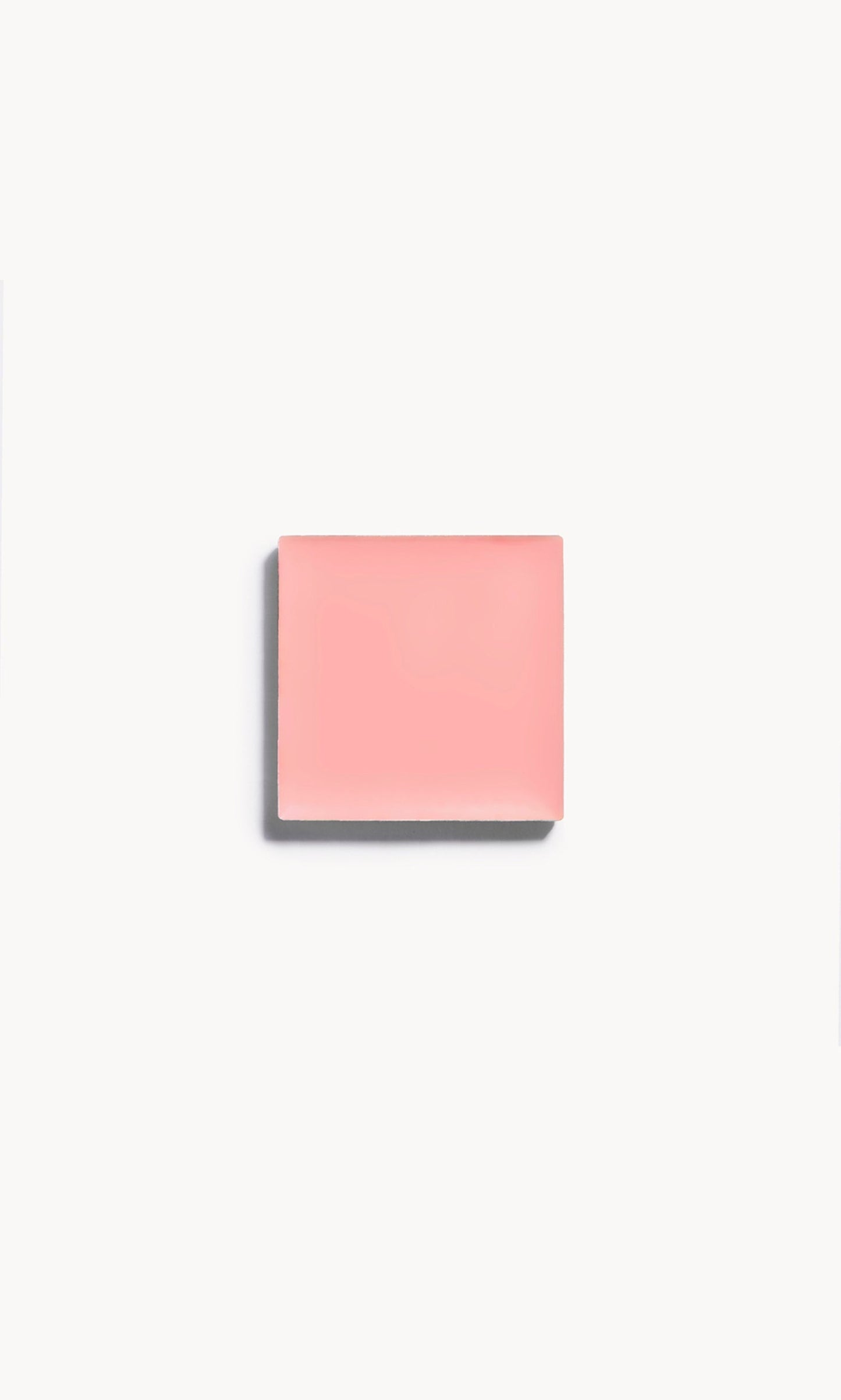 A square of nude pink cream blush on a white background