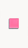 A square of vibrant pink cream blush on a white background