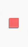 A square of bright coral cream blush on a white background