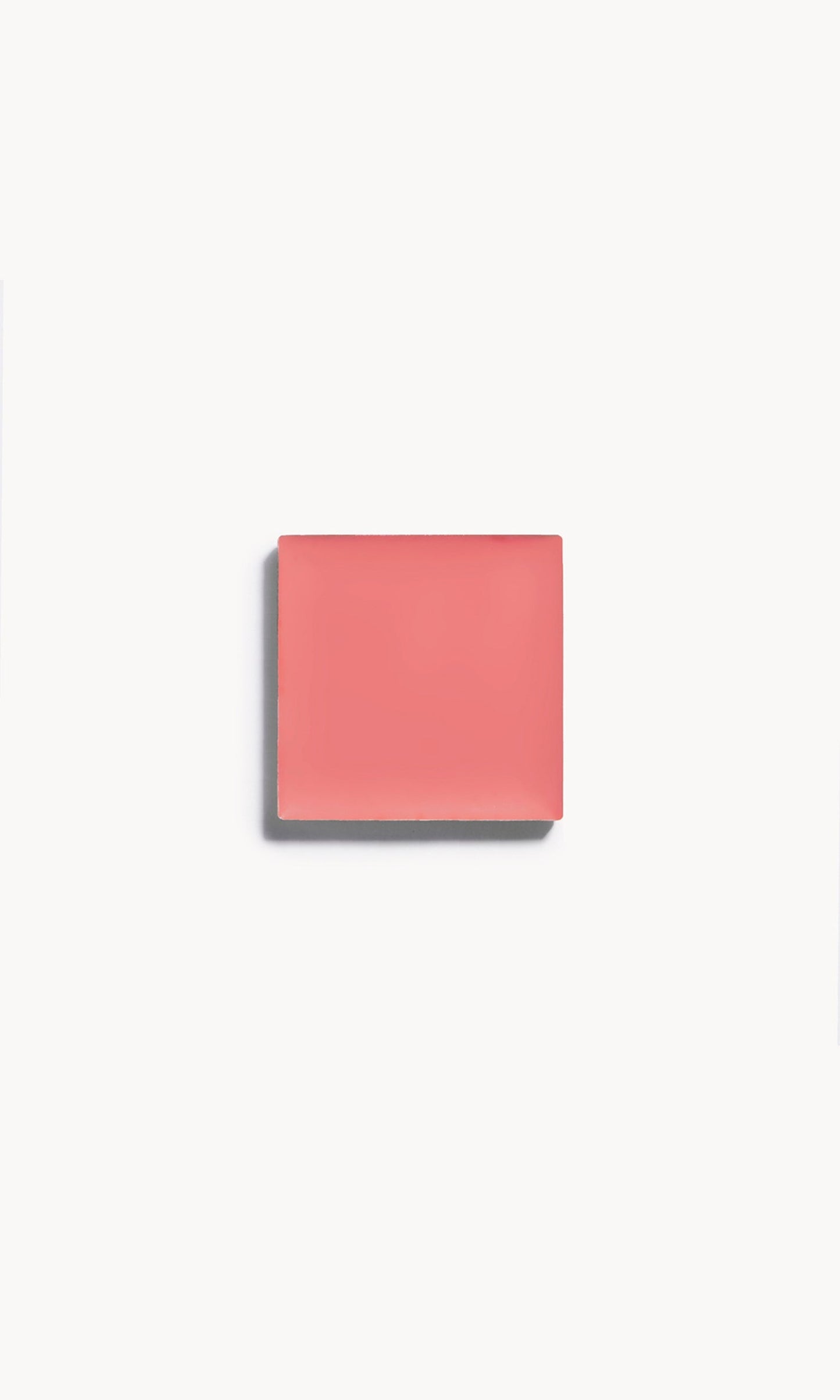 A square of rosy pink cream blush on a white background