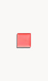 A square of warm coral cream blush on a white background