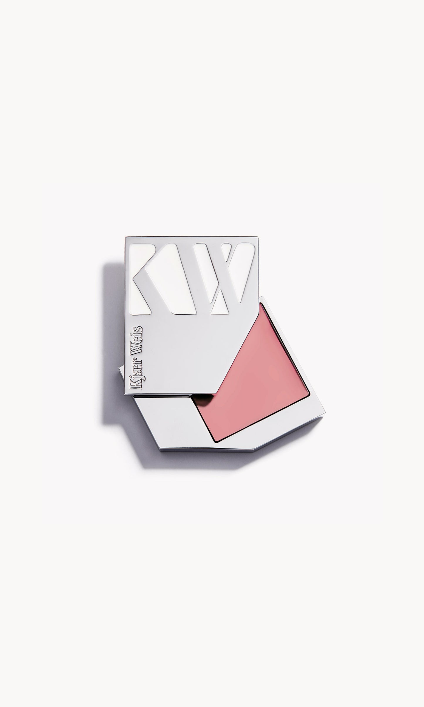 A solid silver KW palette with the lid slid open to show the cream blush