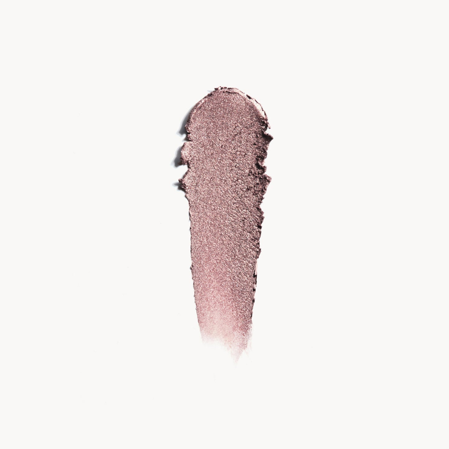 A wipe of medium taupe eye shadow on a white background