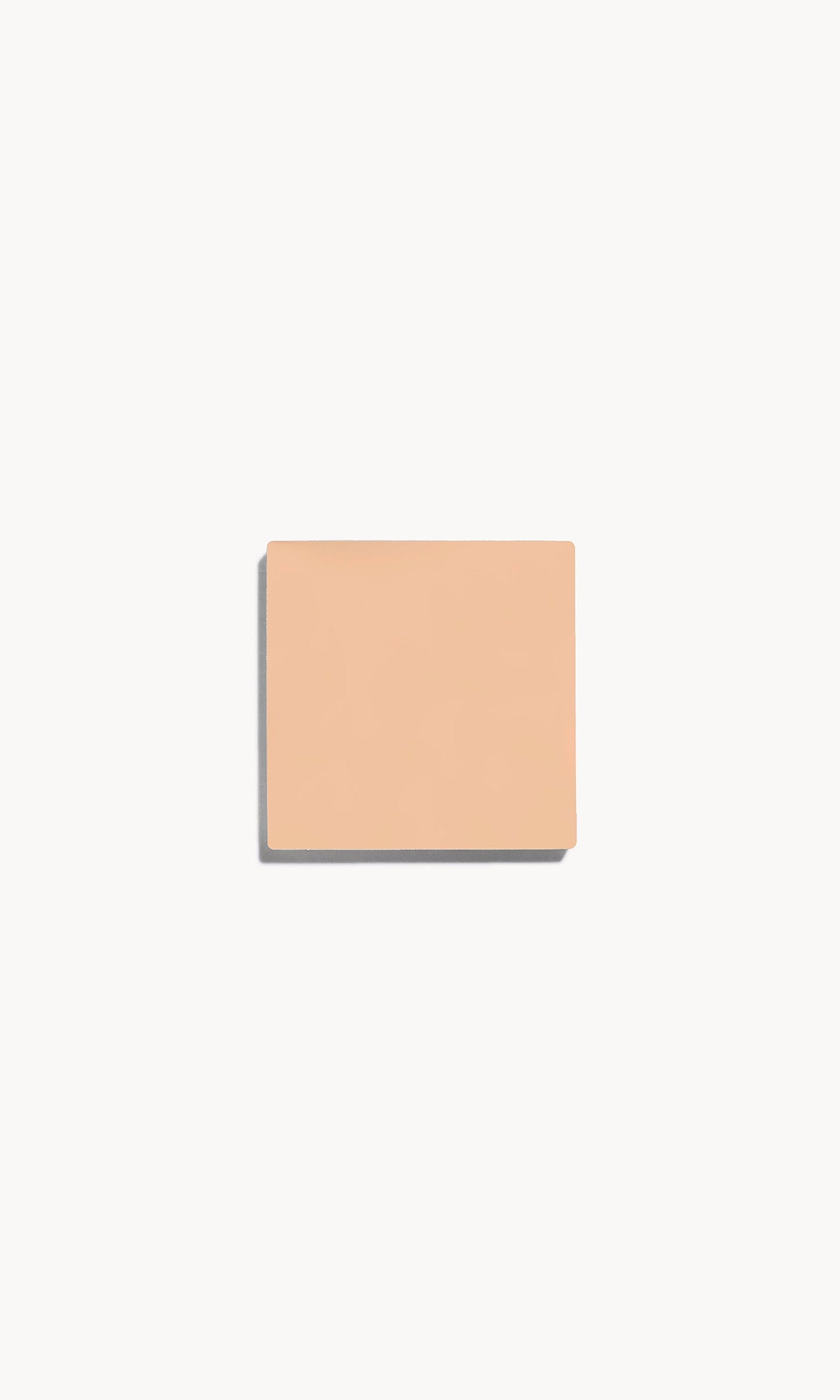 Square of fair neutral cream foundation on a white background