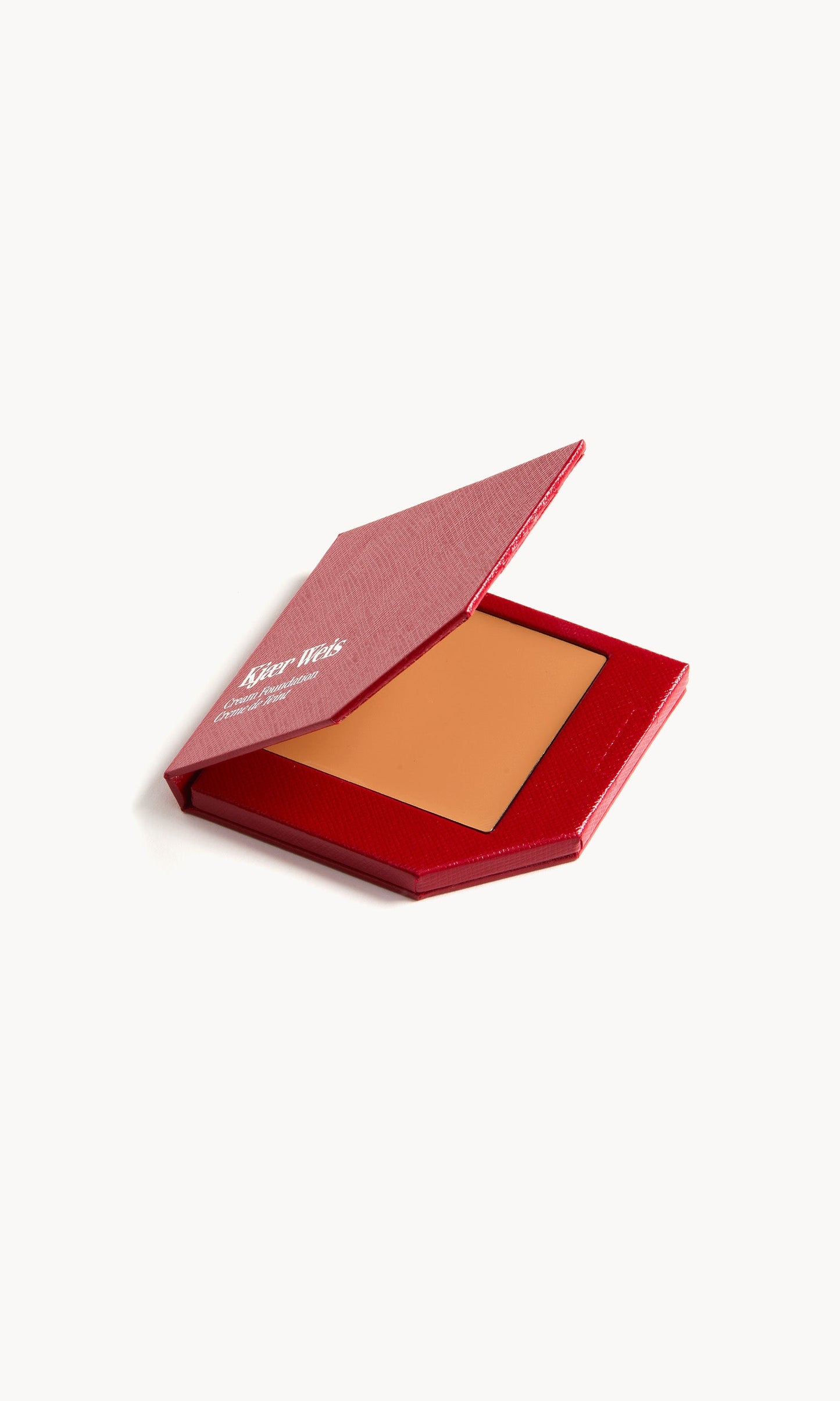 Red KW palette with lid open to show cream foundation