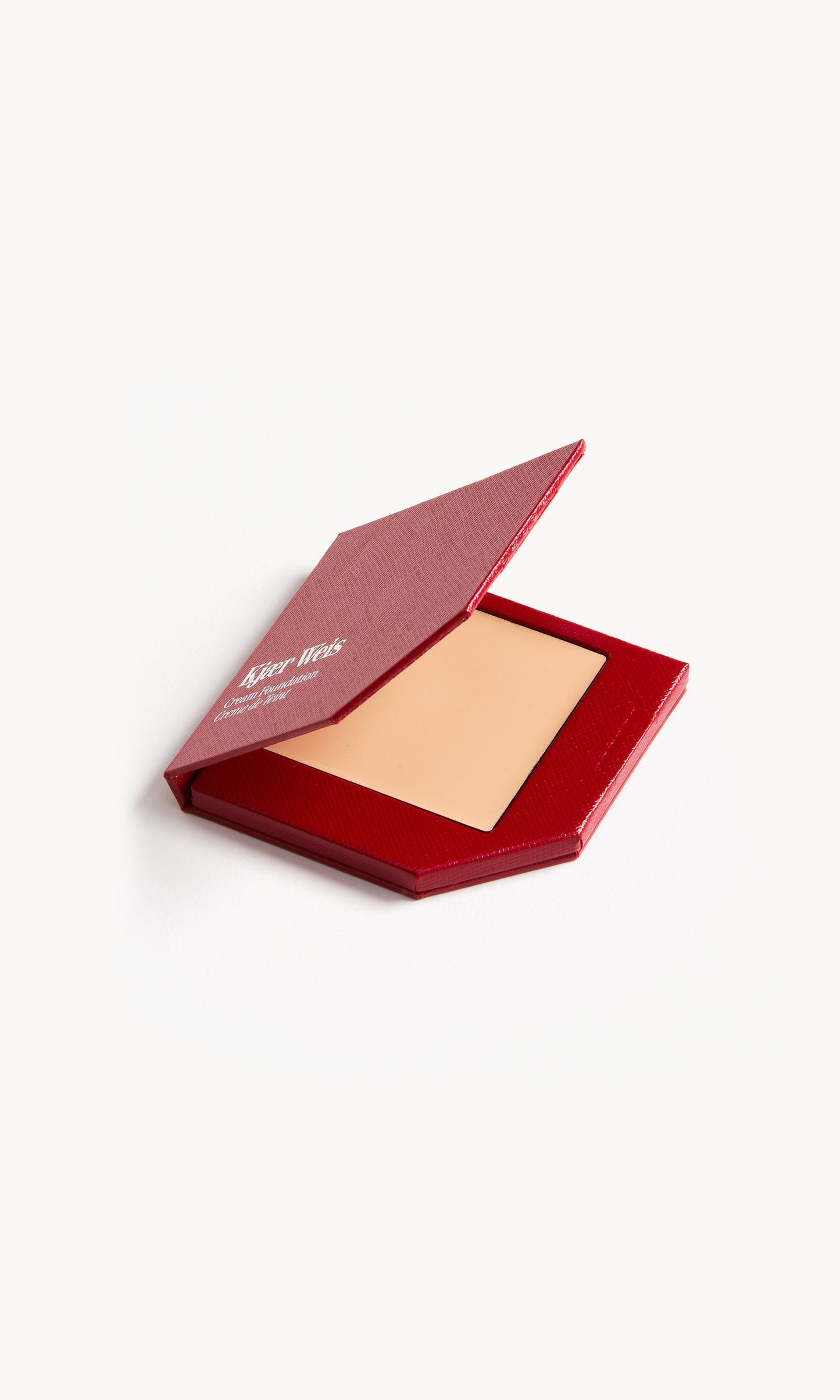Red KW palette with lid open to show cream foundation