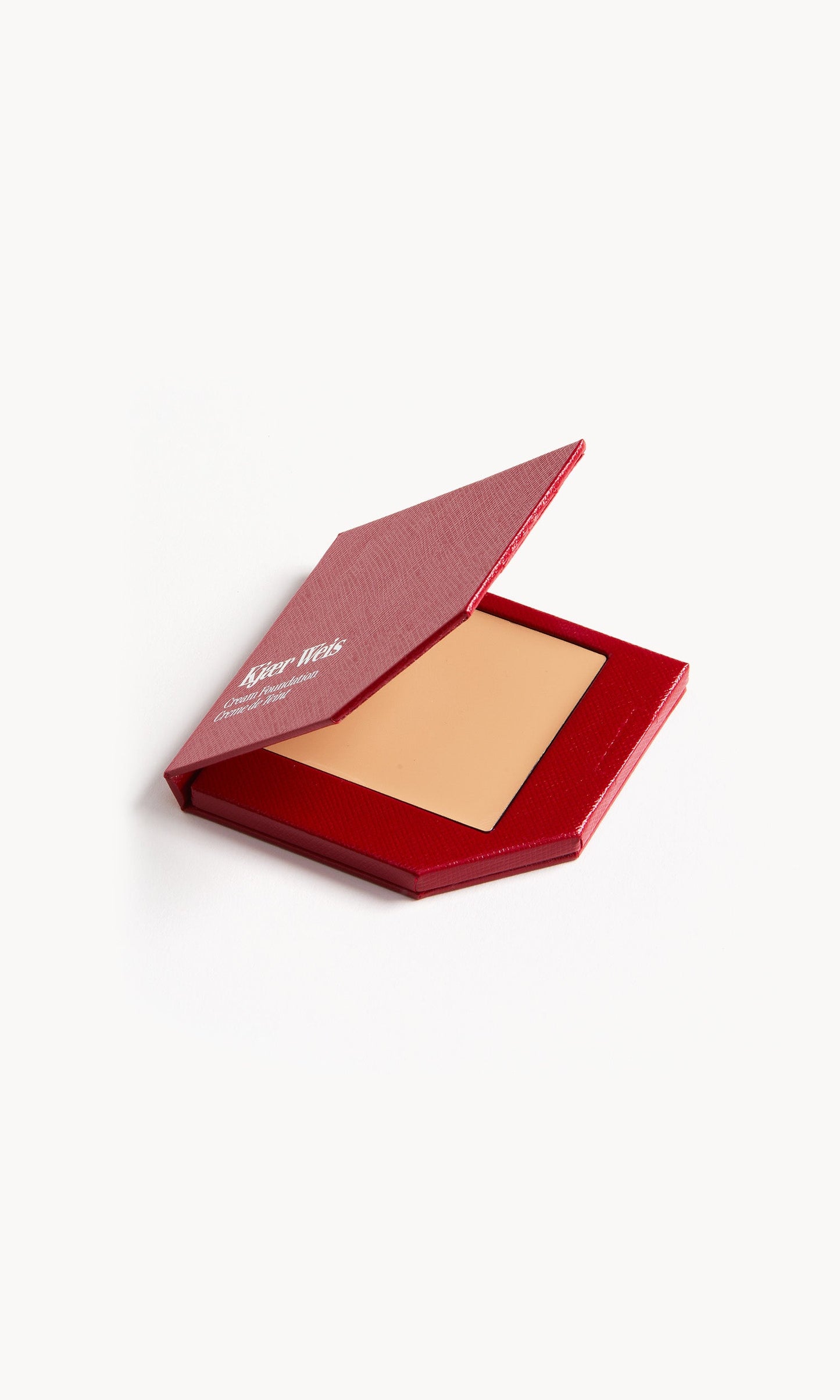 Red KW palette with lid open to show cream foundation