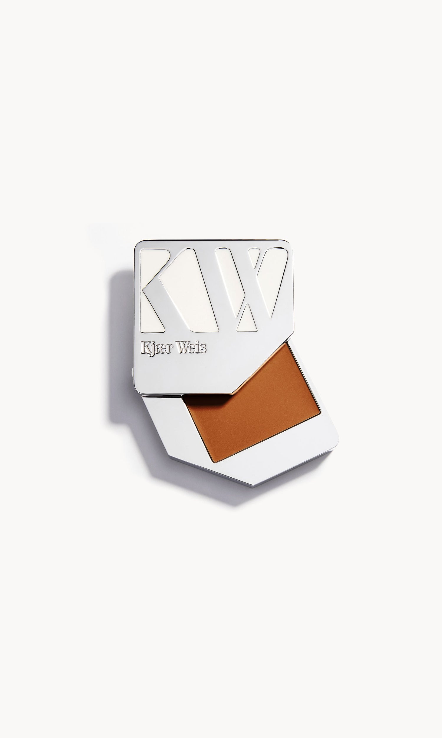 solid metal palette with the lid slid open to show the cream foundation