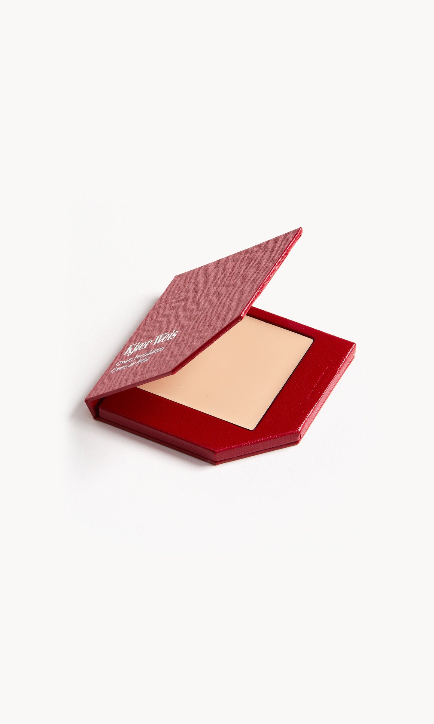 Red KW palette with lid open to show cream foundation