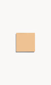 Square of light warm cream foundation on a white background