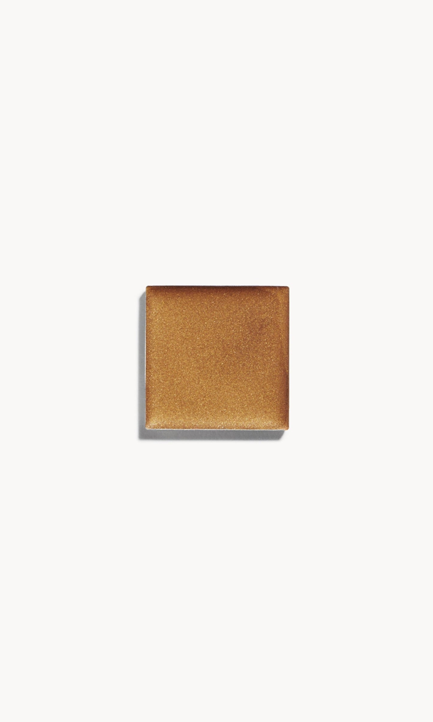 A square of cool-toned cream bronzer on a white background