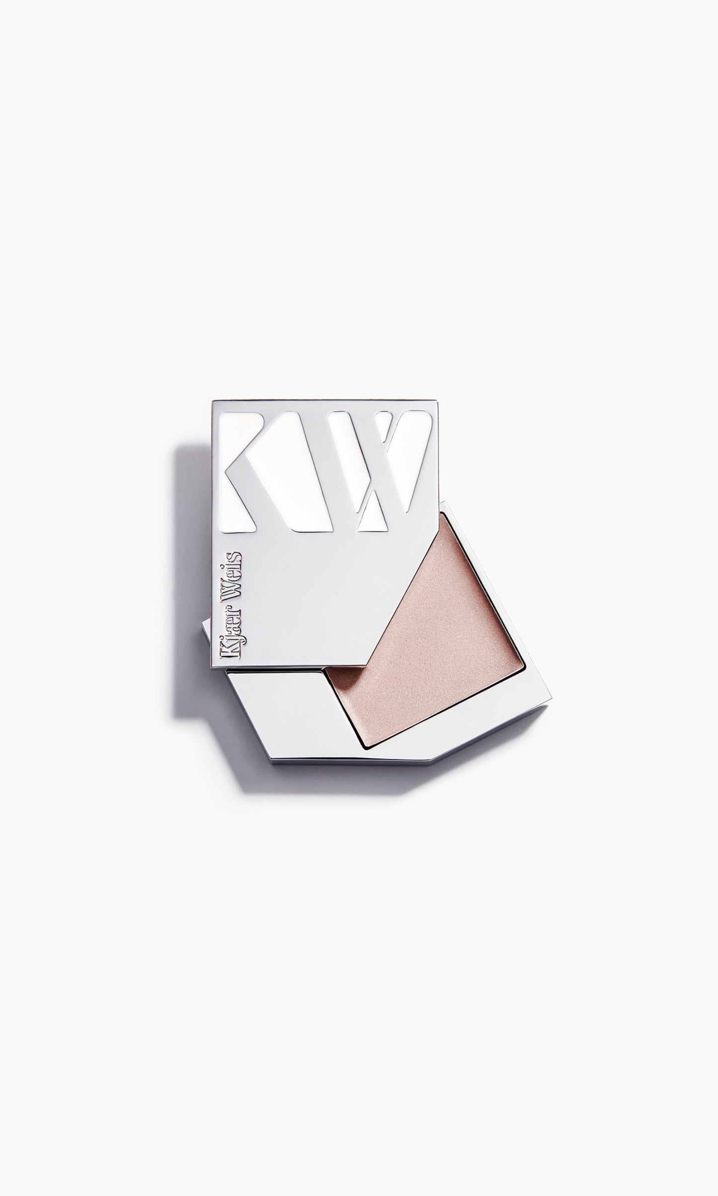 A solid metal KW palette with the lid slid open to show the cream highlighter