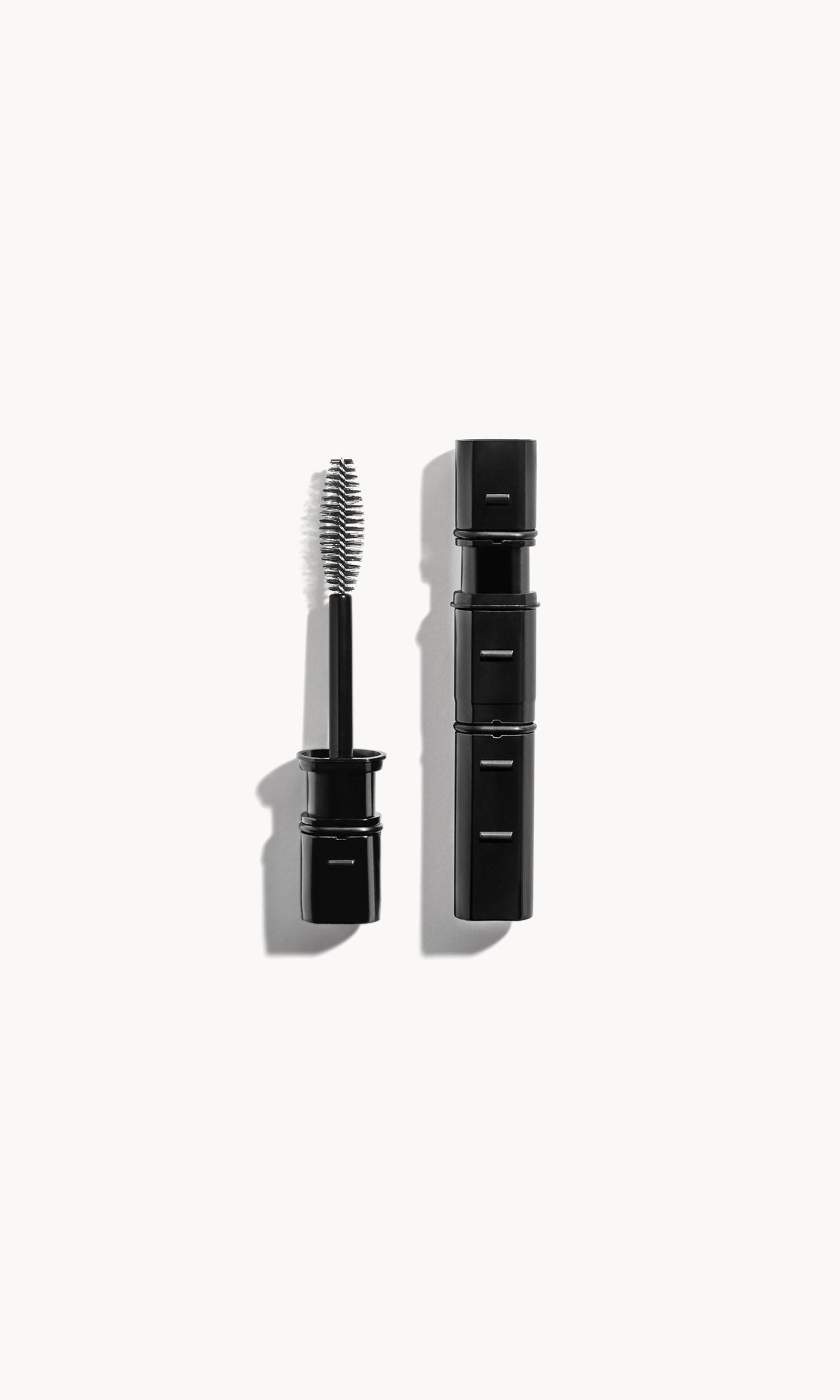 Black-packaged Im-Possible mascara refill on a white background