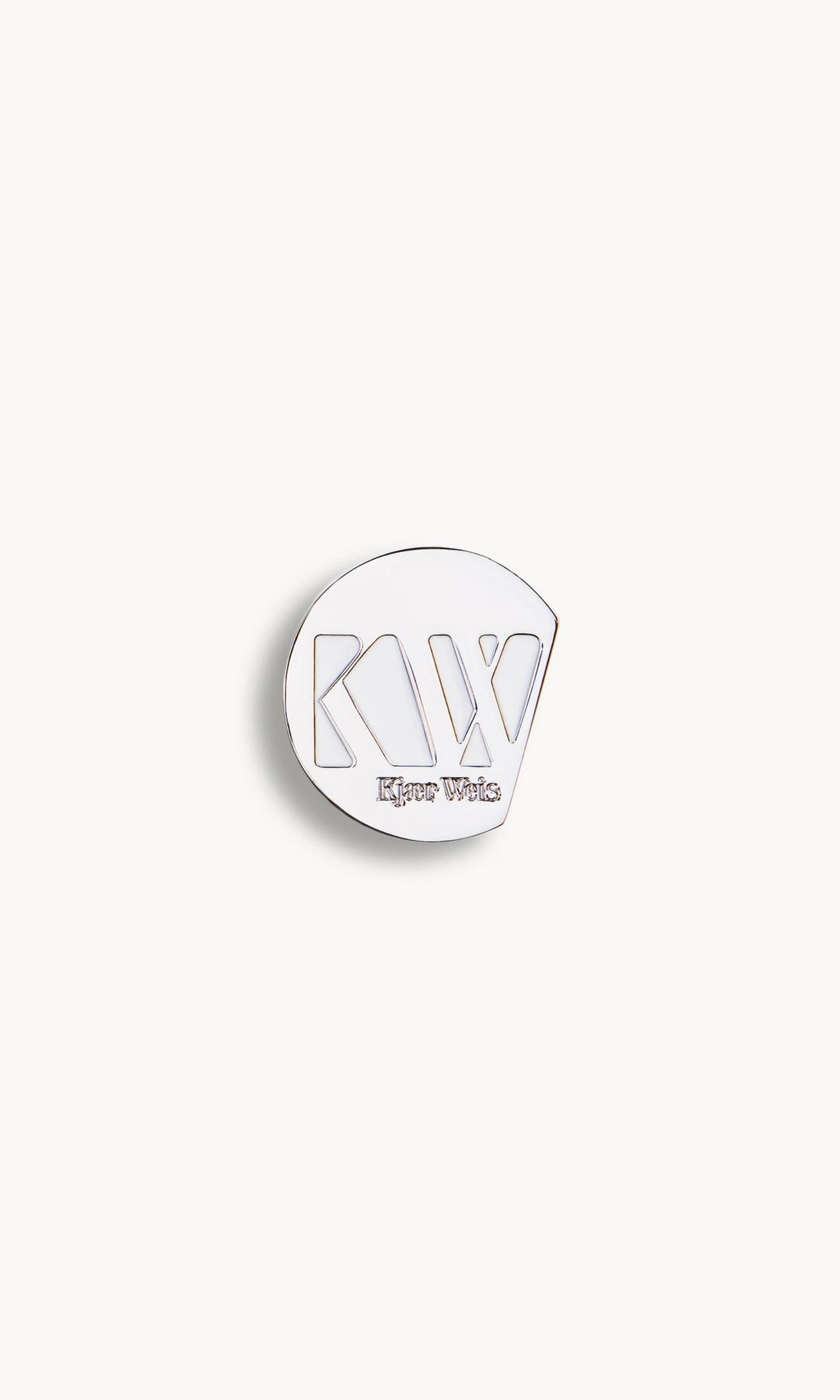 Solid metal circle palette with KW and Kjaer Weis embossed