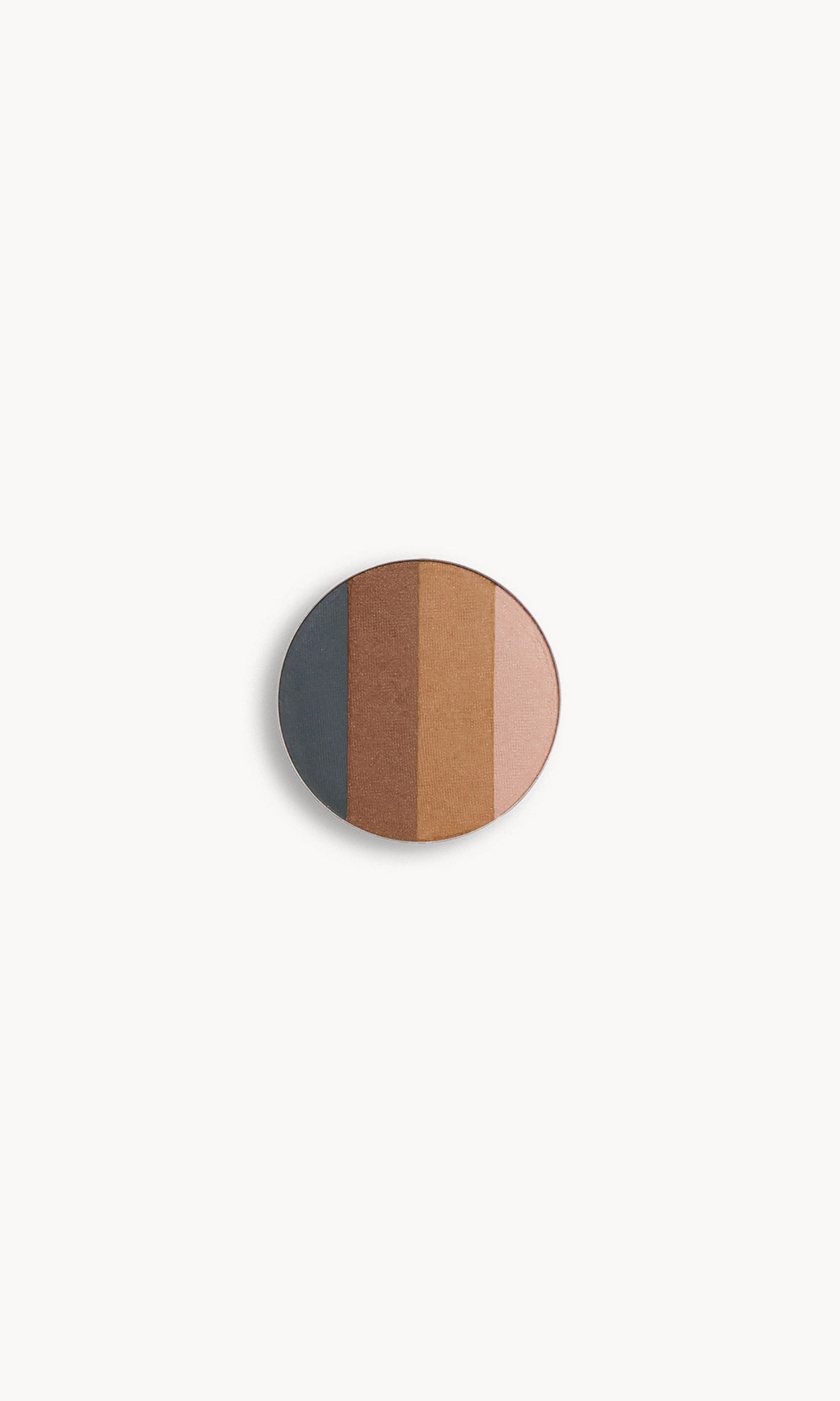 A circle of eye shadow split into four shades on a white background