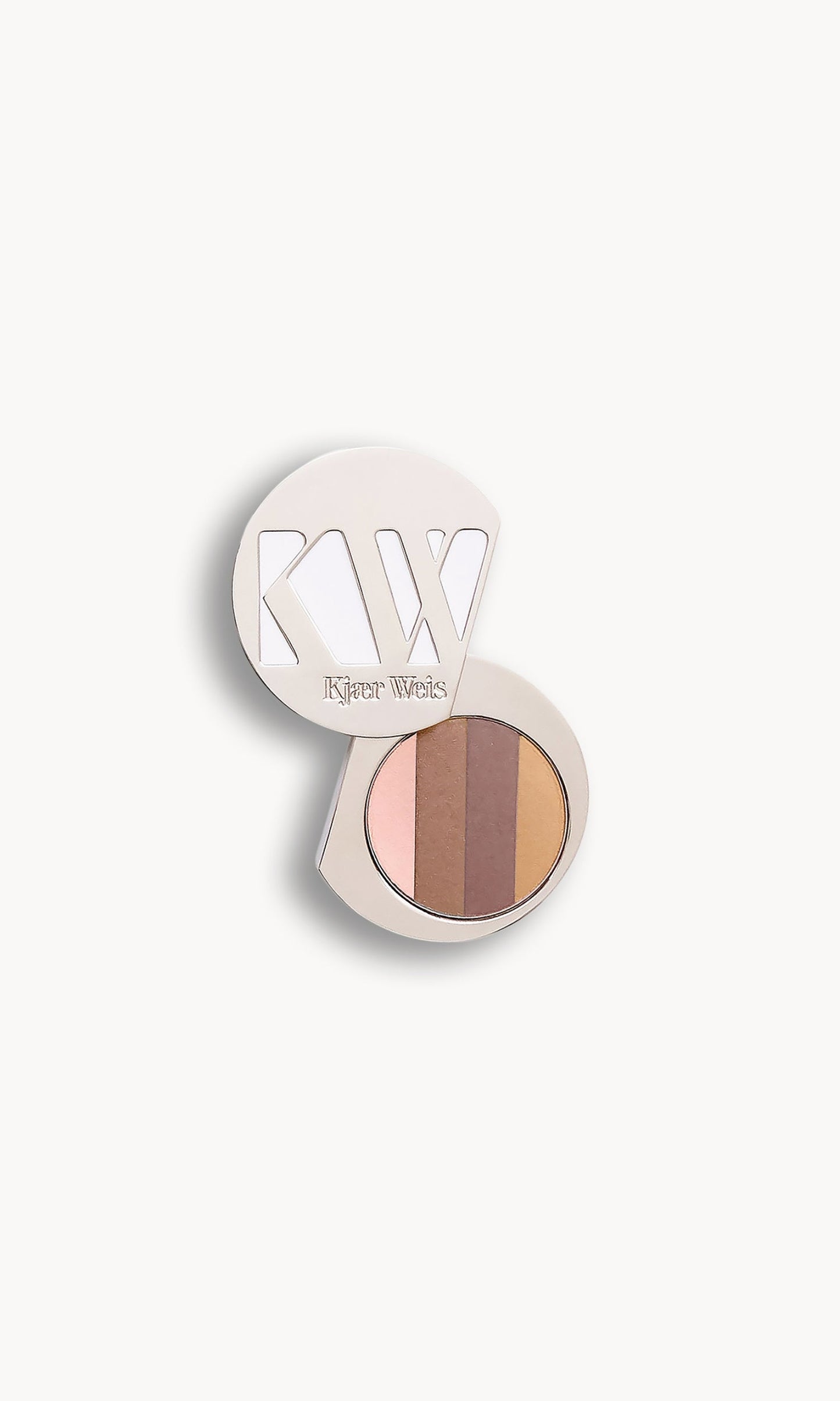 Solid metal KW palette with lid open to show a circle of eye shadow split into four shades