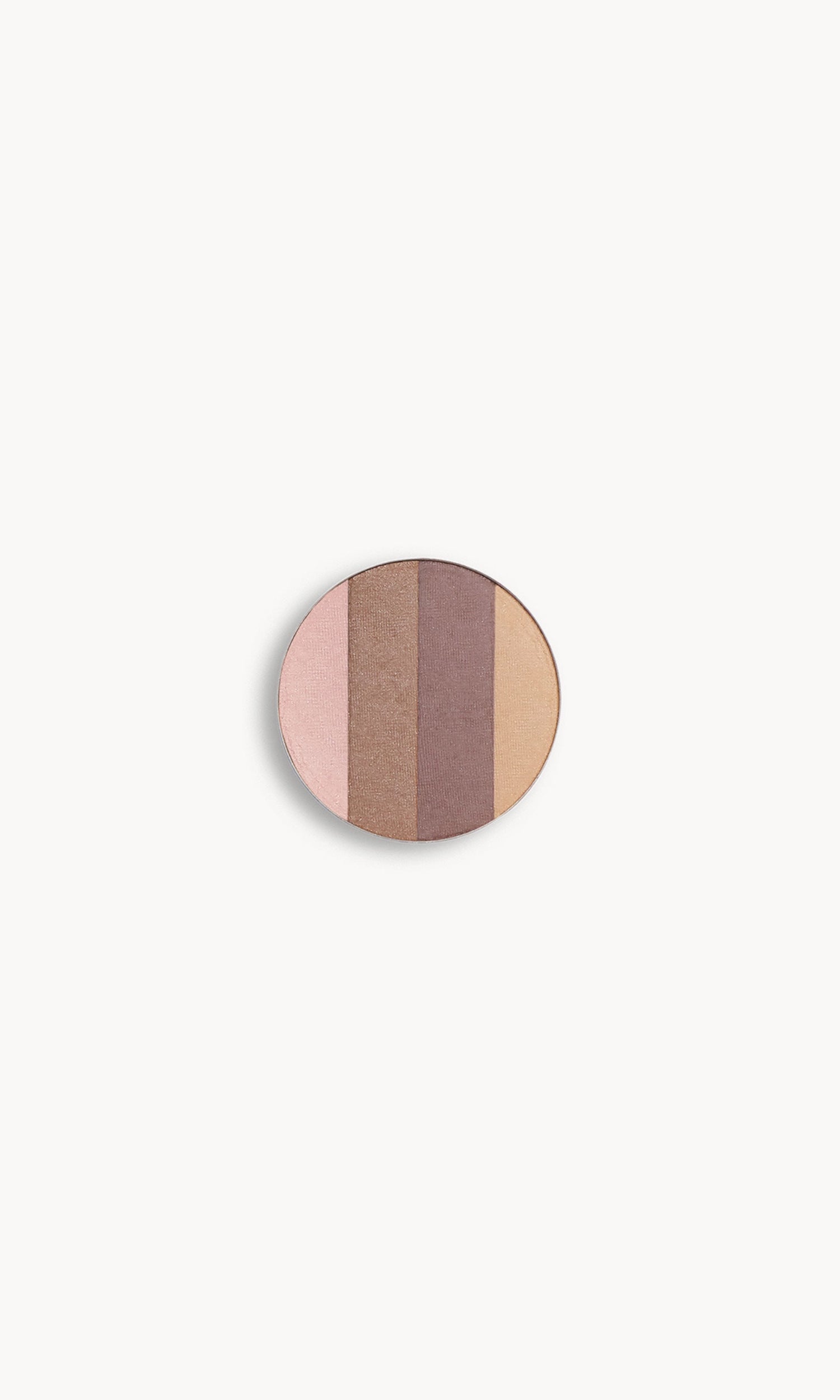 a circle of eye shadow split into four shades on a white background