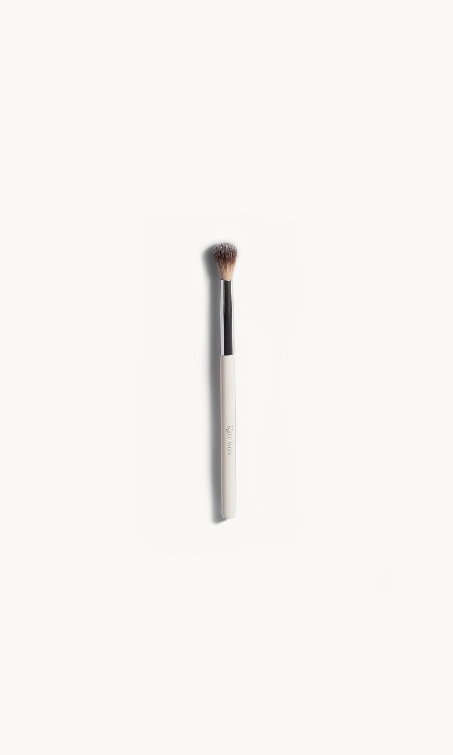 Brush with white and silver handle and mid-length brown bristles