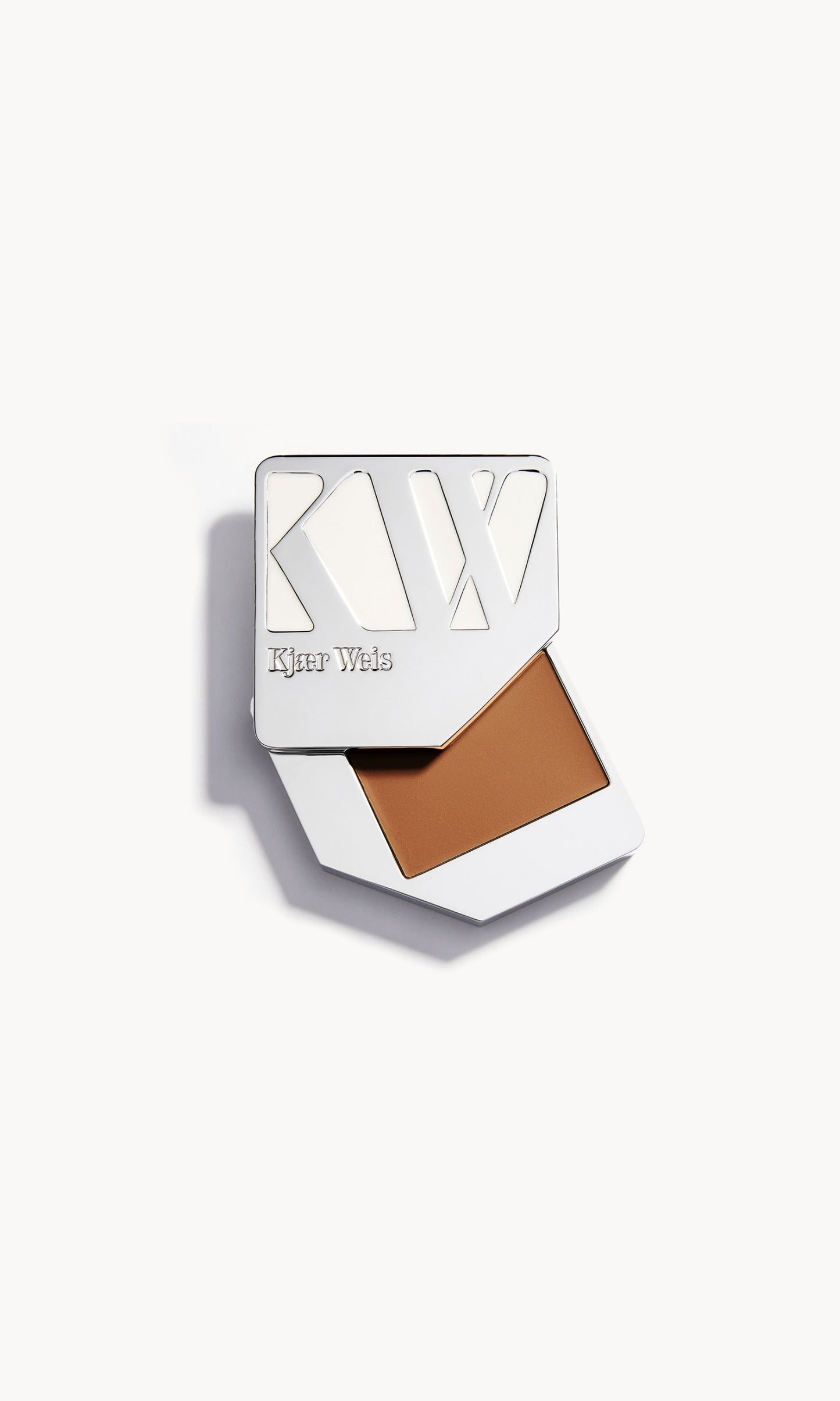 Solid metal palette with the lid slid open to show the cream foundation