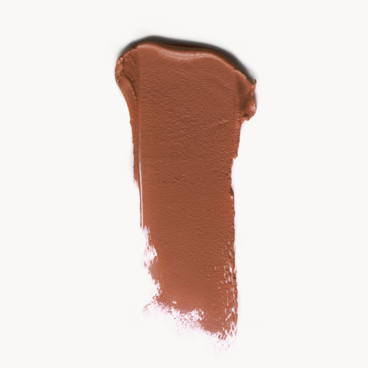 a wipe of soft warm neutral cream blush on a white background