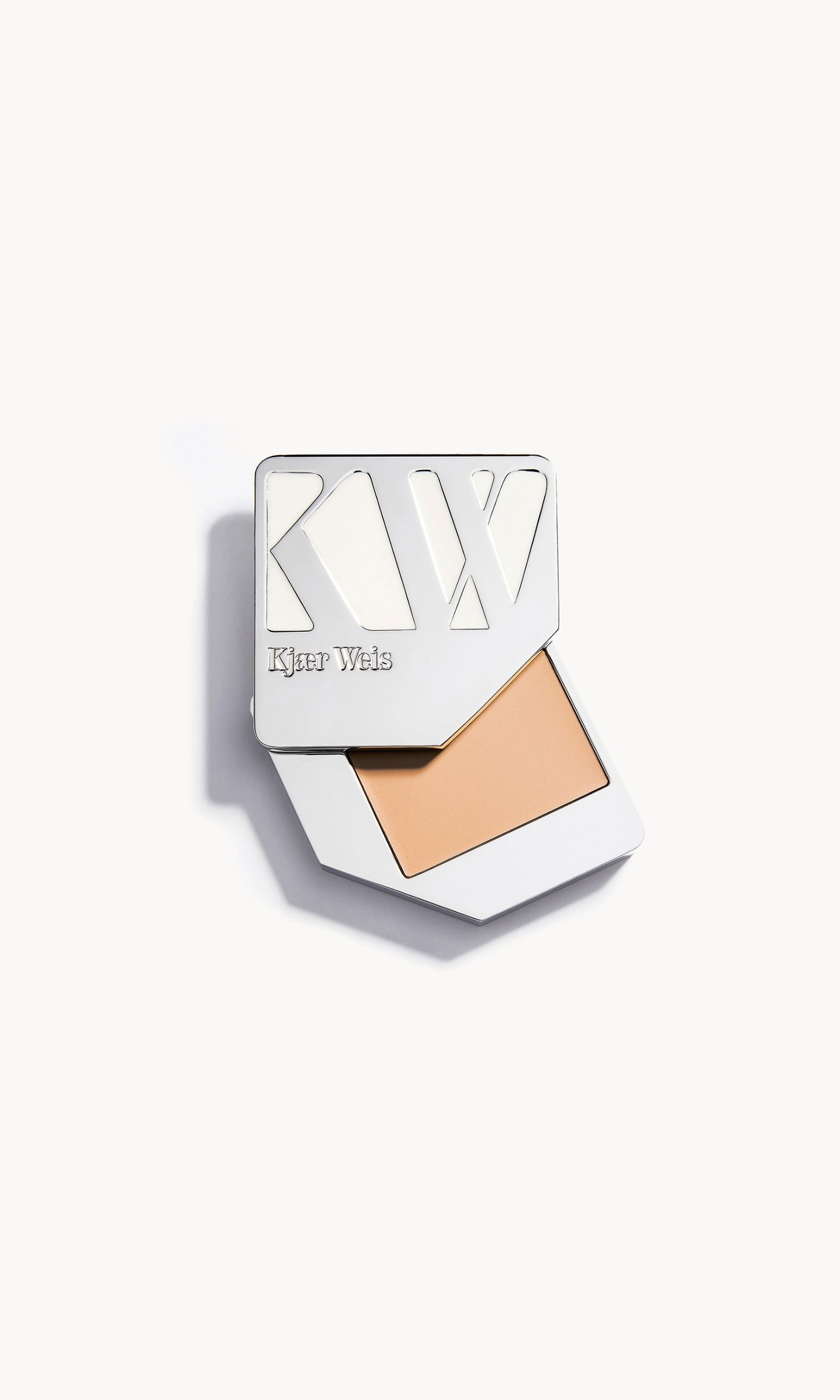 Solid metal palette with the lid slid open to show the cream foundation
