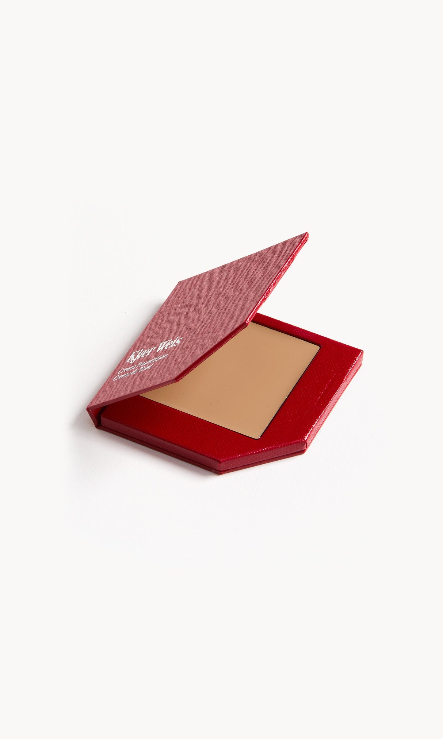 Red KW palette with lid open to show cream foundation