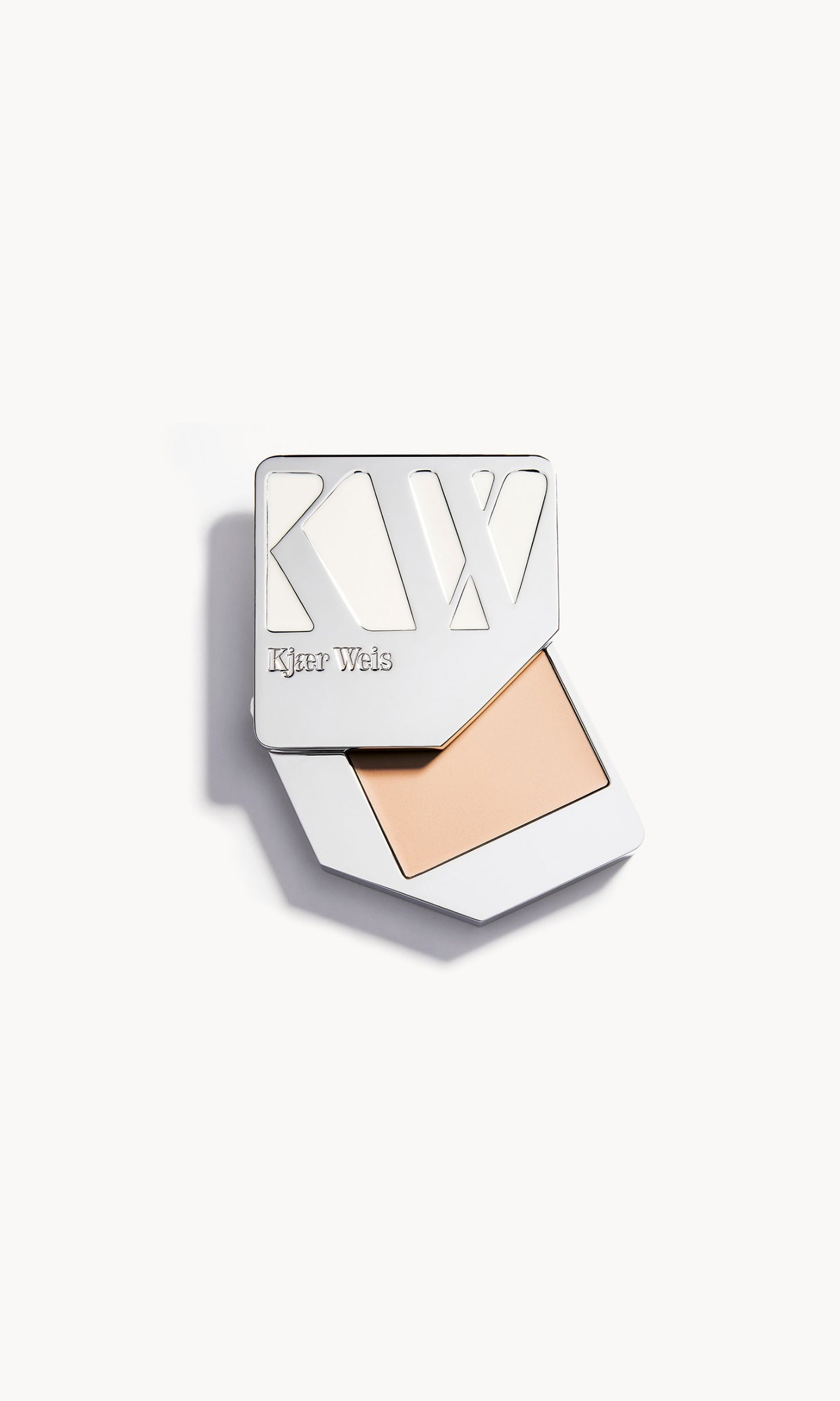Solid metal palette with the lid slid open to show the cream foundation