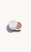 Solid metal KW palette with lid open to show iridescent champagne pink eye shadow inside