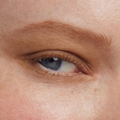 Close up of a person’s eye wearing brown-gold eye shadow