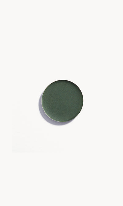 Refill pan of the Kjaer Weis Cream Eye Shadow in the shade Sublime, a dark, moody green velvet.