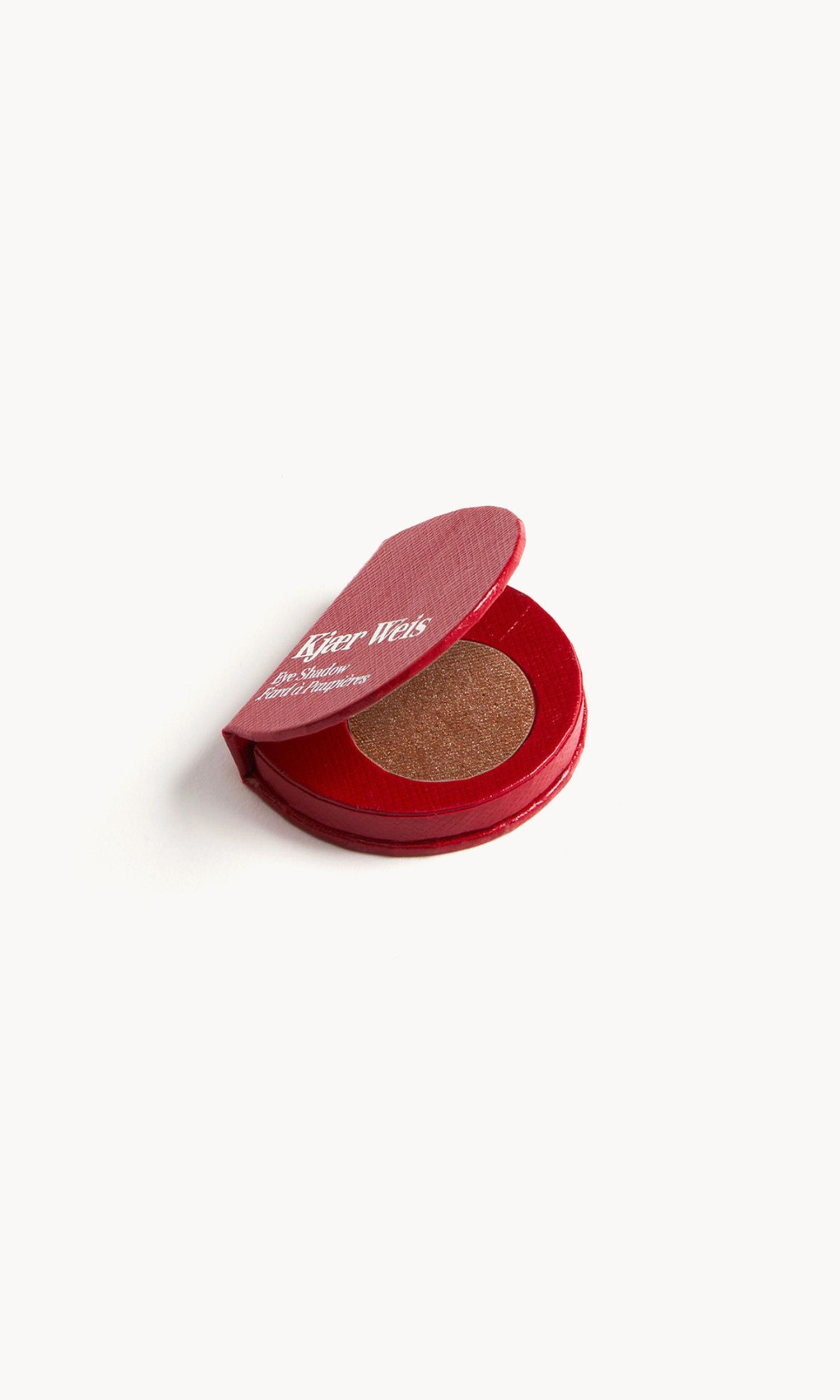 red kw palette open to show the warm brown eye shadow inside