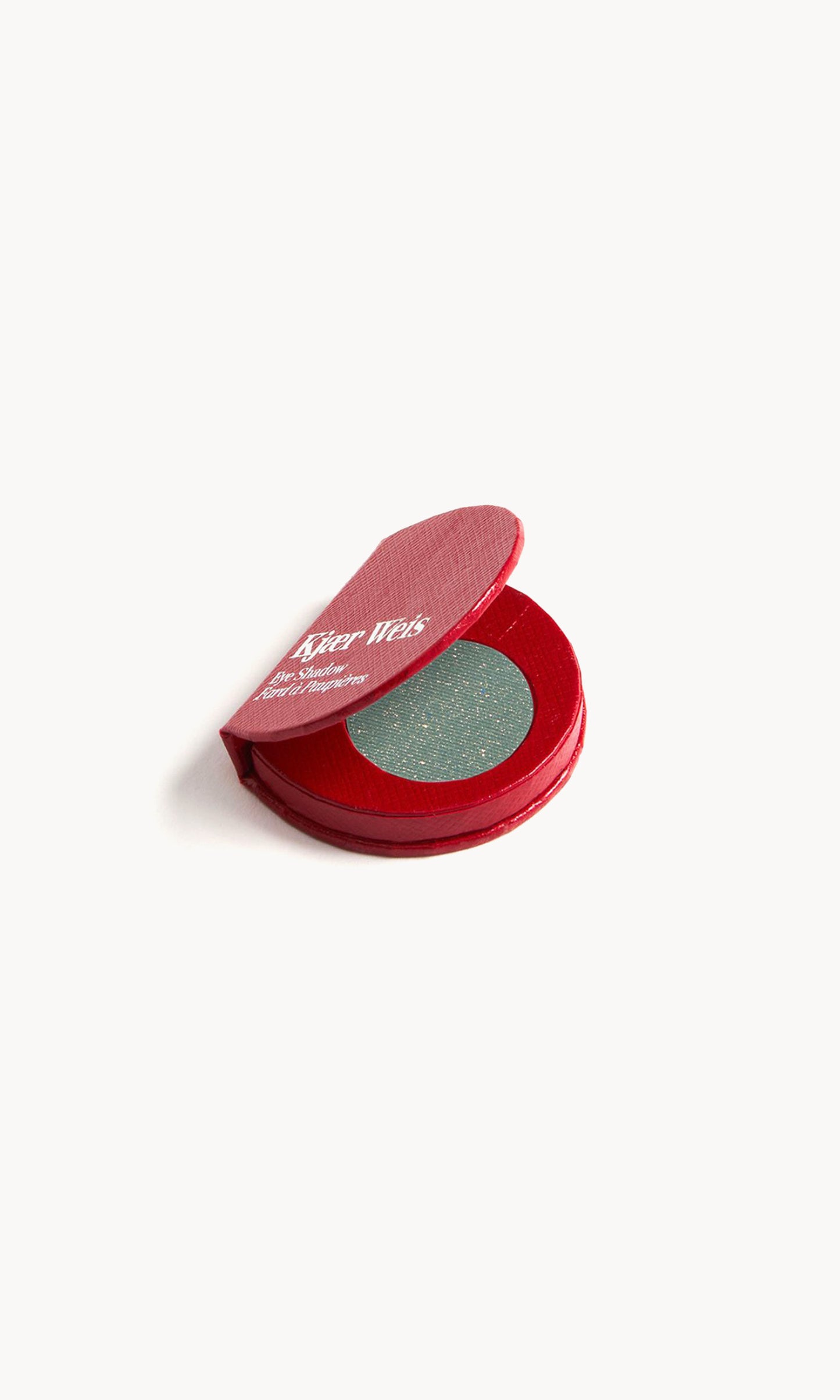 Red KW palette open to show the green eye shadow with gold flecks inside