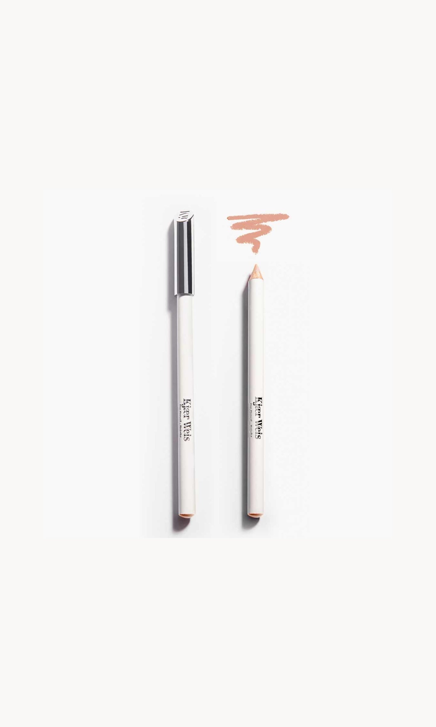 Two white pencils on a white background. Once pencil has a silver lid and the other shows the soft beige pencil with a soft beige line above it