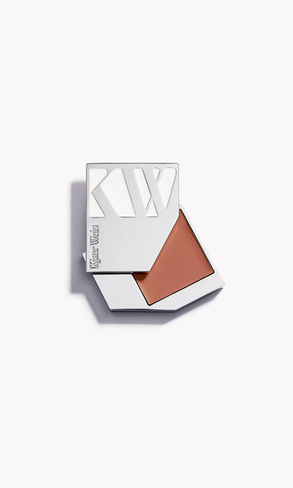 A solid silver KW palette with the lid slid open to show the cream blush