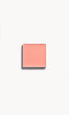 A square of soft peach cream blush on a white background