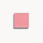 A square of cool pink cream blush on a white background