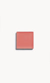 A square of soft coral cream blush on a white background