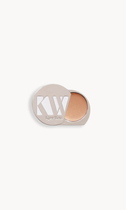 Solid metal palette with lid slid open to show cream eye shadow