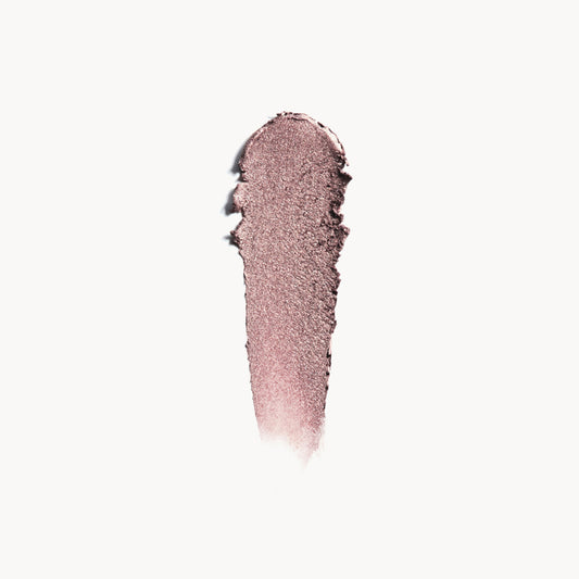 a wipe of medium taupe eye shadow on a white background