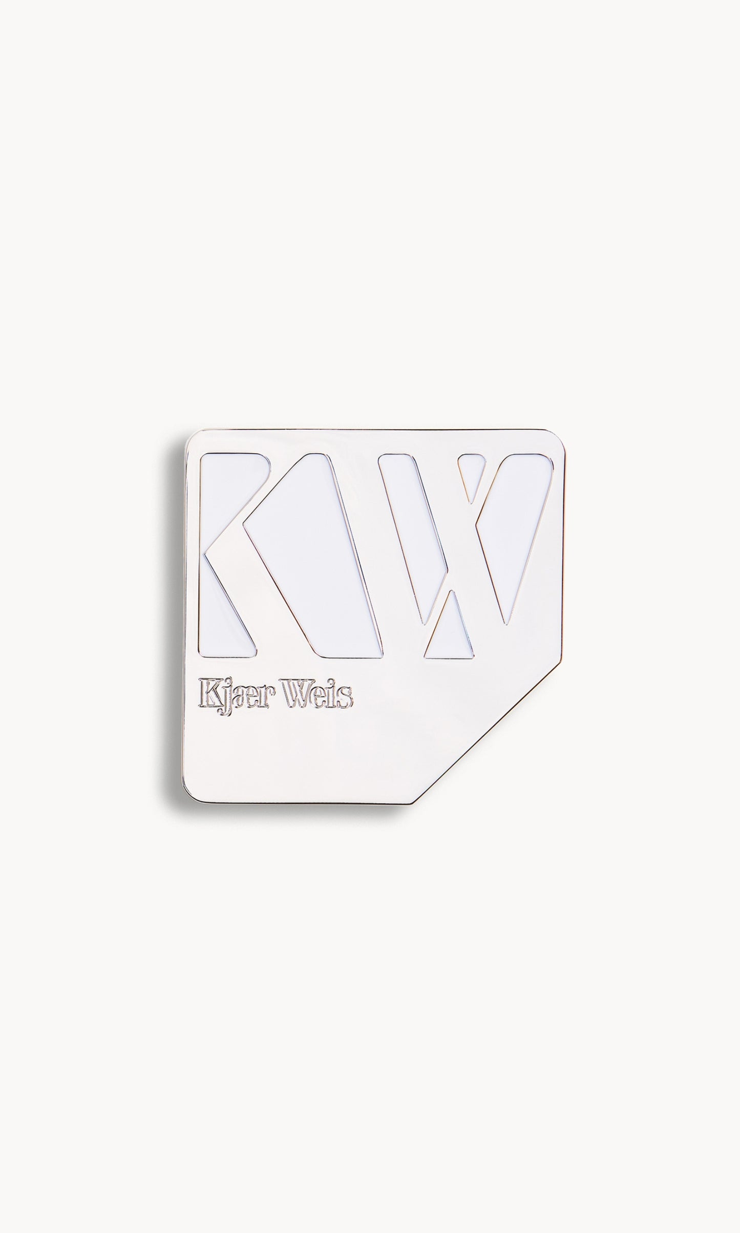 Silver palette with KW and Kjaer Weis embossed on it