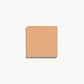 Square of medium neutral-toned cream foundation on a white background