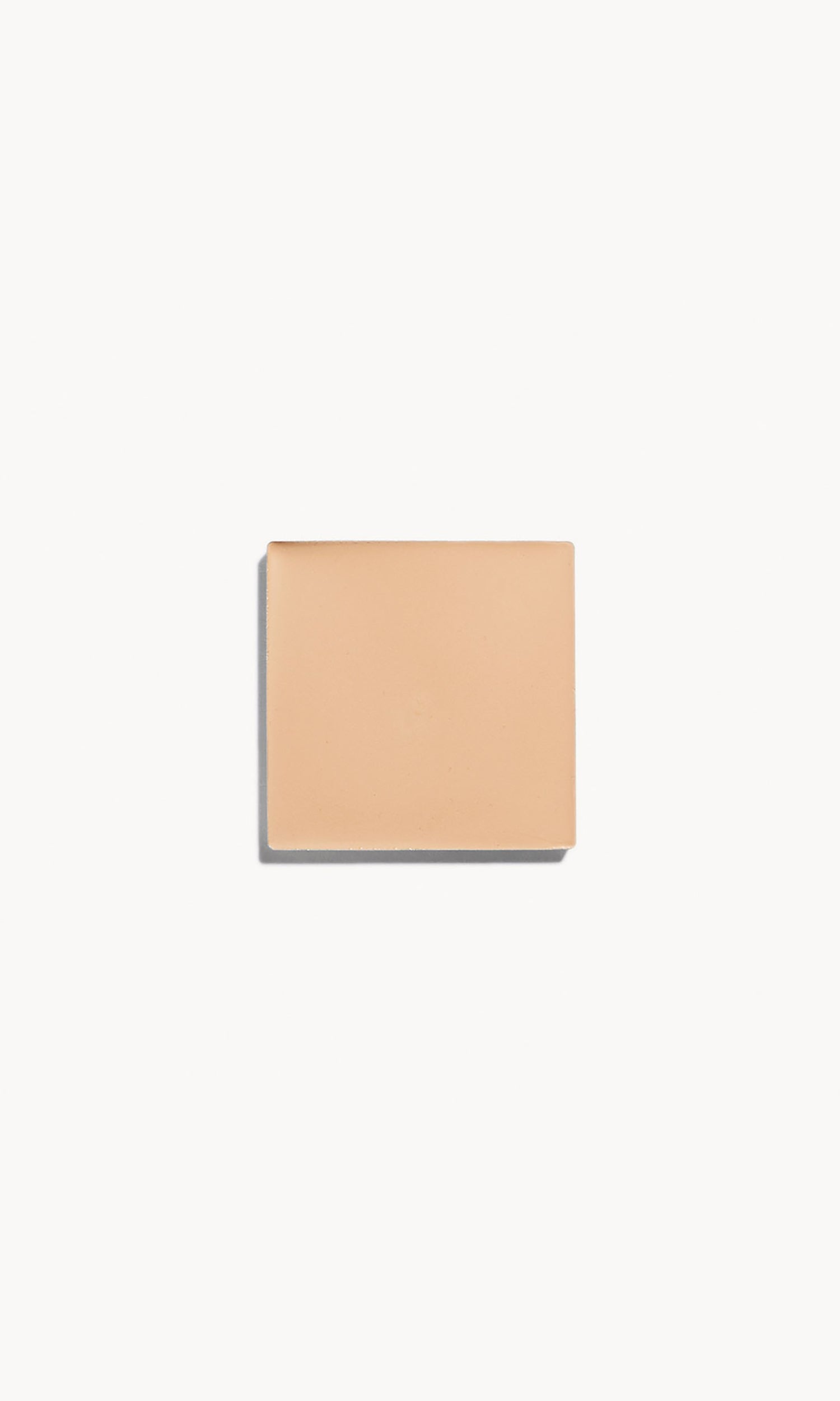 Square of fair neutral cream foundation on a white background